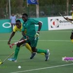 Ghana’s Abbiw Charles gives his Nigerian opponent a hot chase